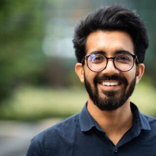 confident-rich-eastern-indian-businessman-standing-modern-big-city (1)